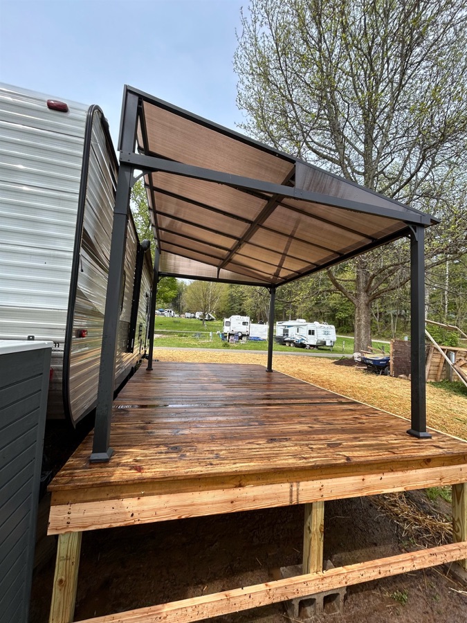Clean wood deck beneath an outdoor pavilion