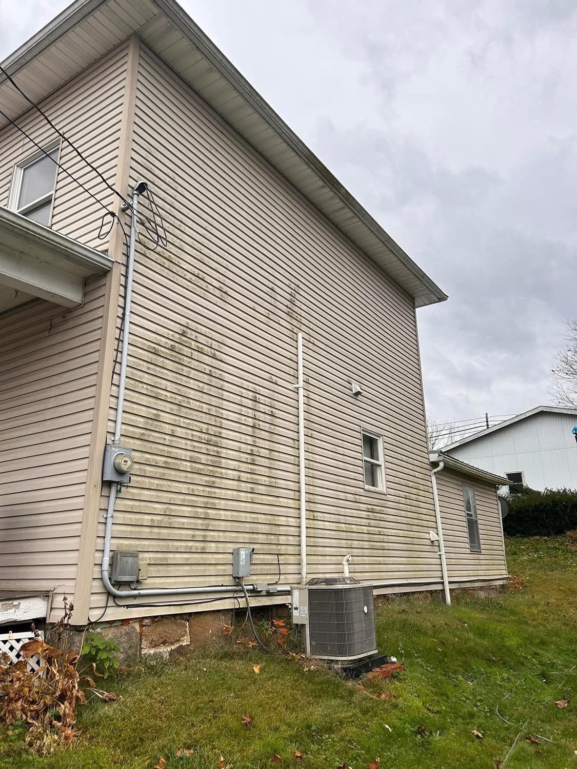 House siding before pressure washing
