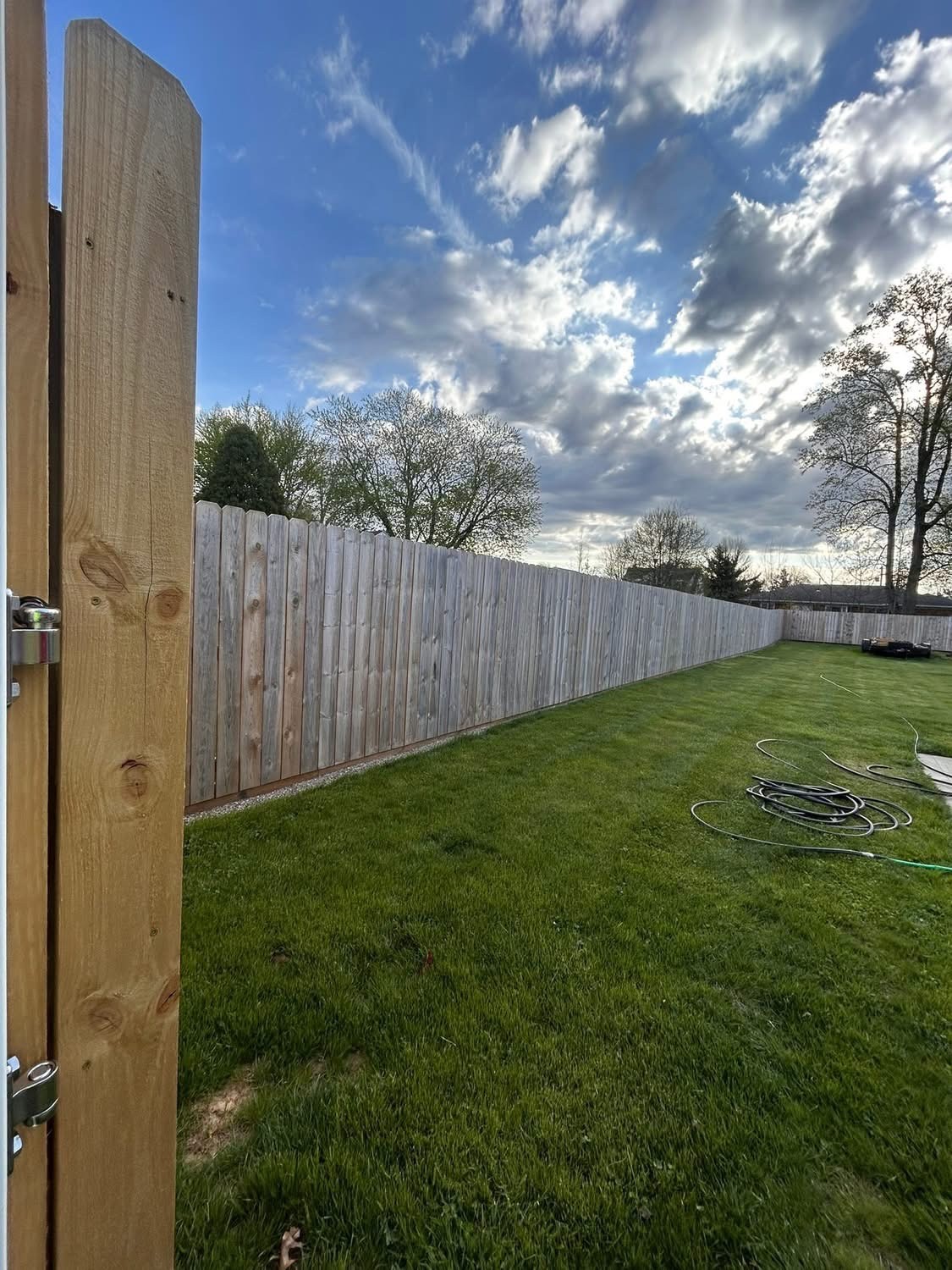 Yard with old gray fence before